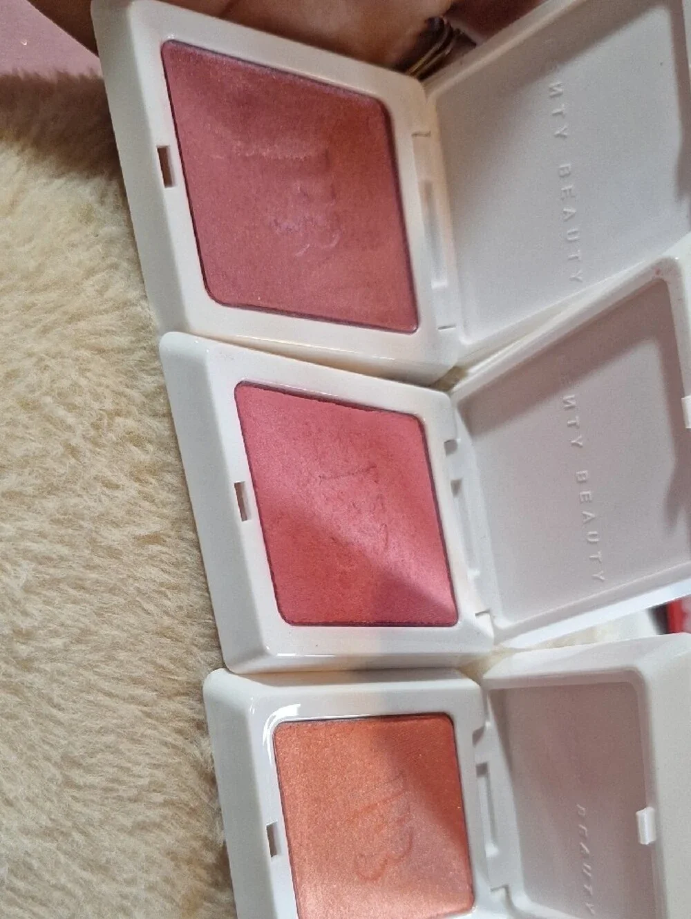Fenty Beauty White Compacts with Pink & Orange Star Accents